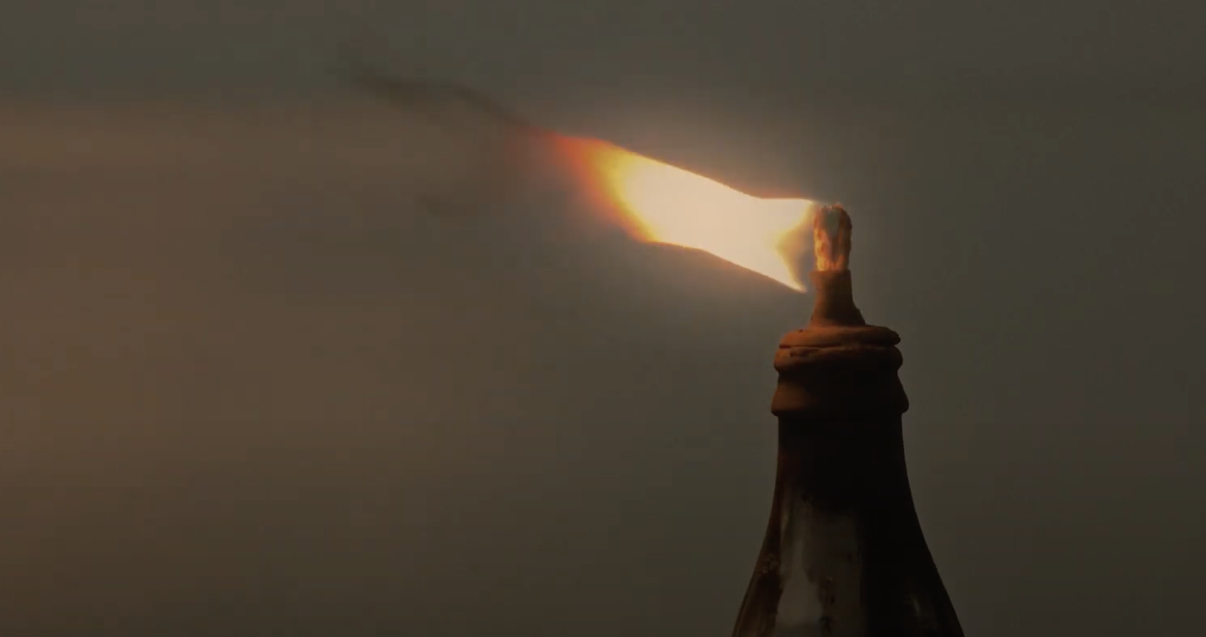 flame blowing aginst the wind